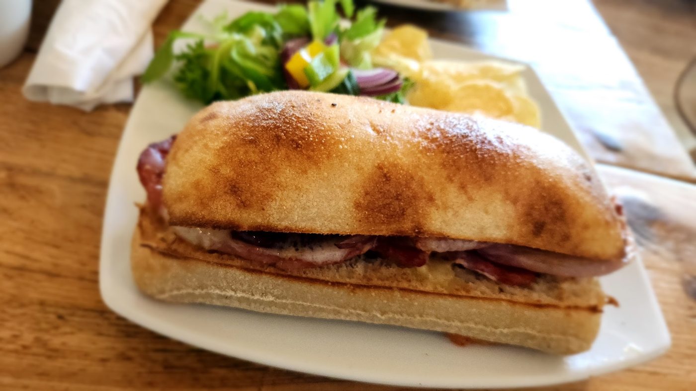 A filled baguette with salad